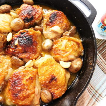Break out the cast iron skillet and enjoy this Skillet Chicken, Mushrooms & Garlic. This one-pan meal that is perfect for a great night in. | Bottom Left of the Mitten