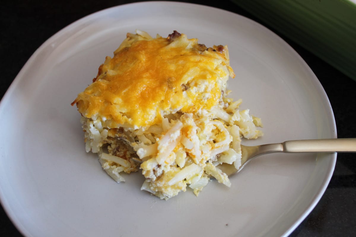 overhead shot of a plate of breakfast casserole with a fork next to it.