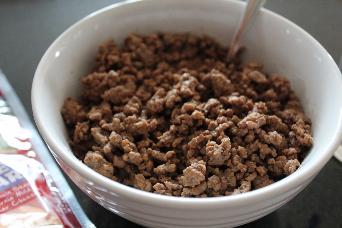 zoomed in shot of seasoned ground beef in a bowl.