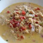 queso chicken chili in a bowl.